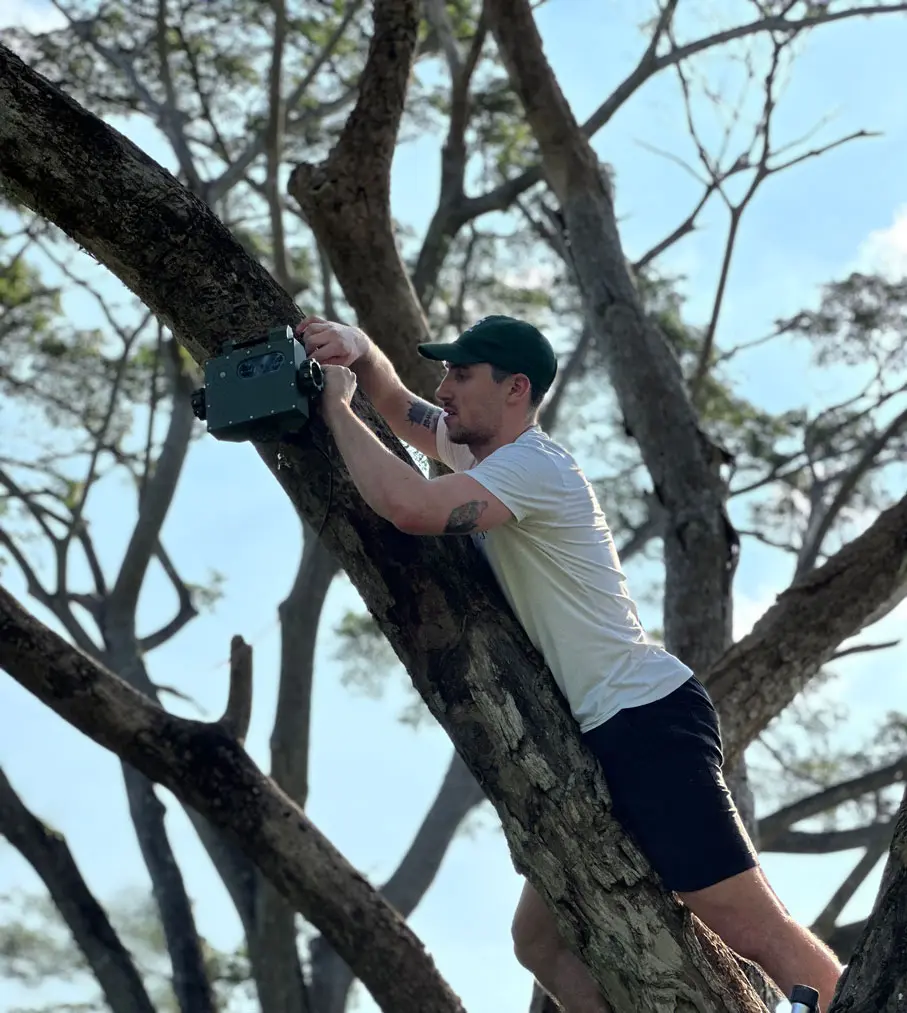 Wildlife researcher working with technology in the field